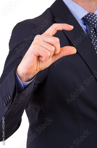 Businessman gesturing small size with fingers.