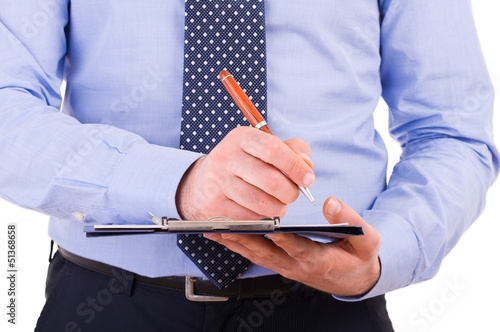 Businessman with pen and clipboard.