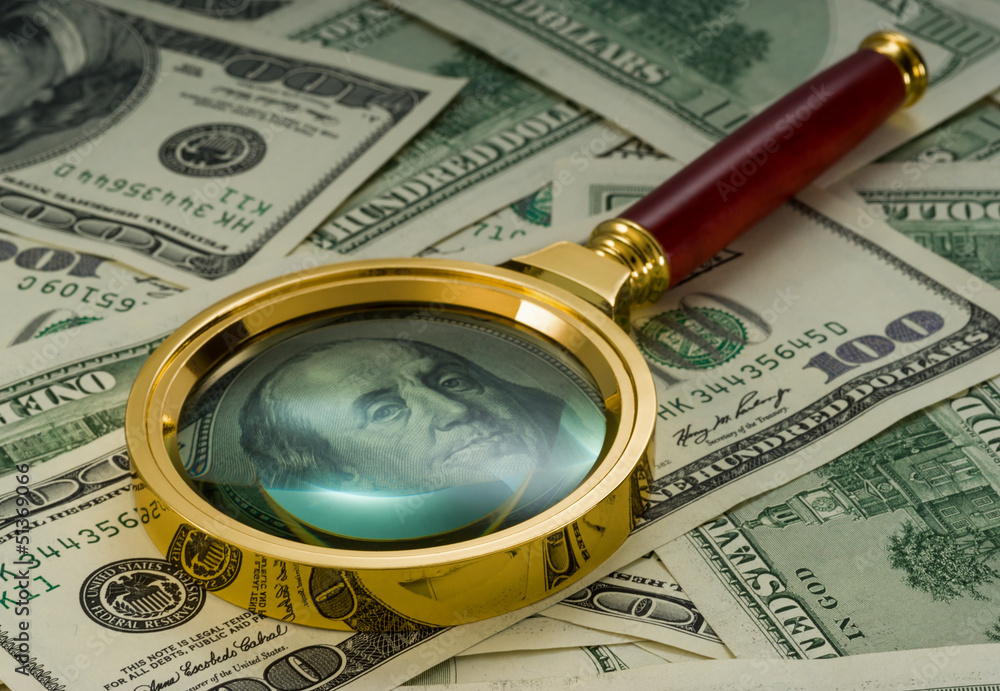 Usa dollars viewed through a magnifying glass Usa dollars viewed through a magnifying glass