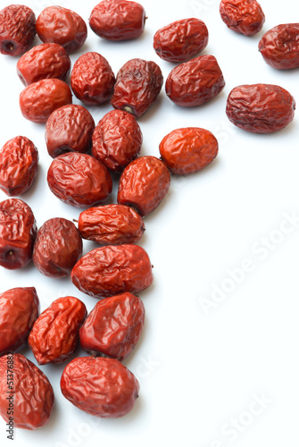 lots of dried jujube on white background photo