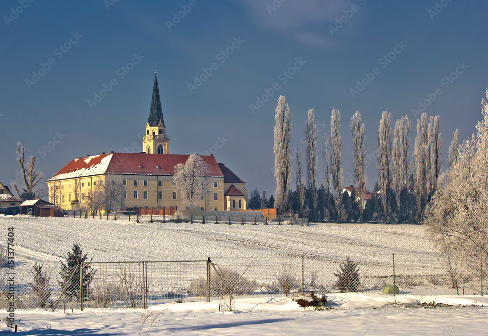 Greek catholic cathedral in snow landscape