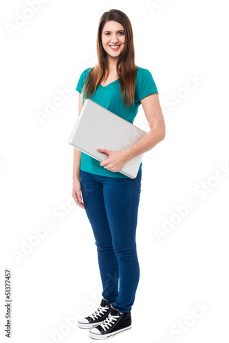 Casual attractive girl holding laptop