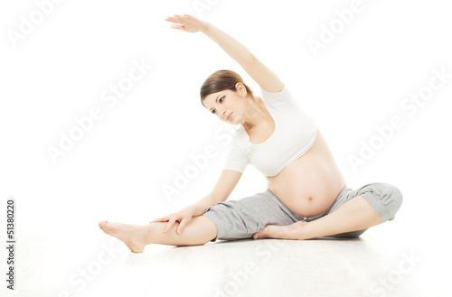 Pregnant woman exercise sport over white background