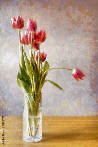 Glass vase with bunch of pink tulips