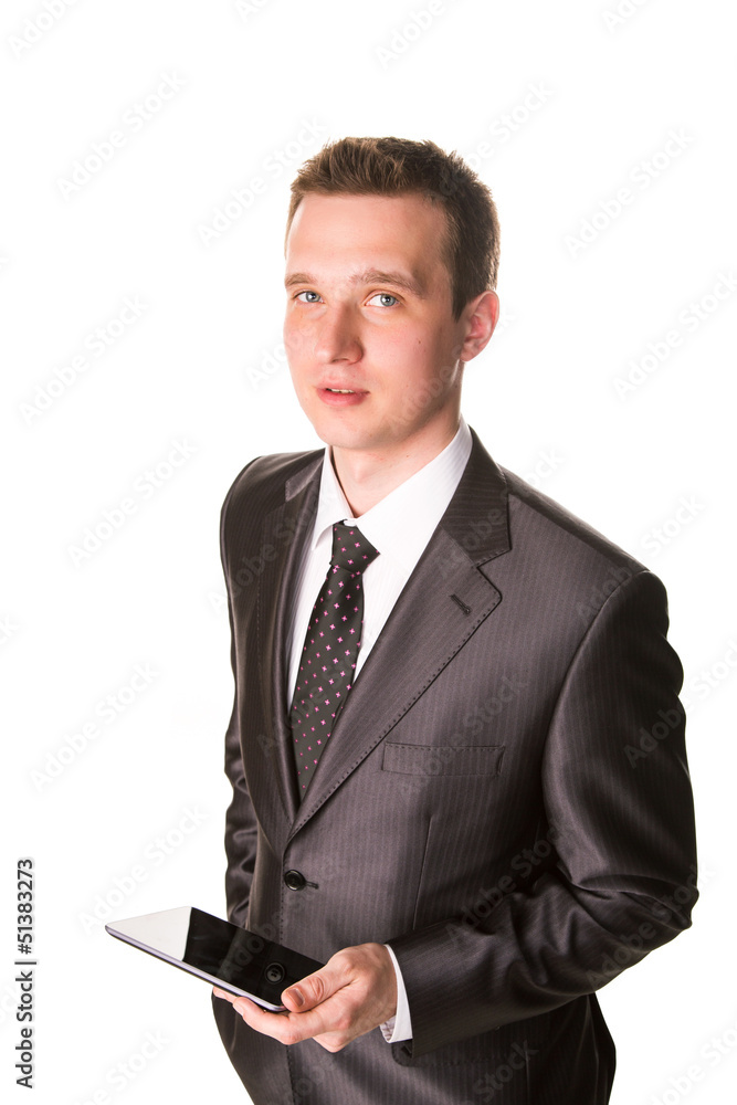 Young businessman working on a tablet pc comuter Young businessman working on a tablet pc comuter