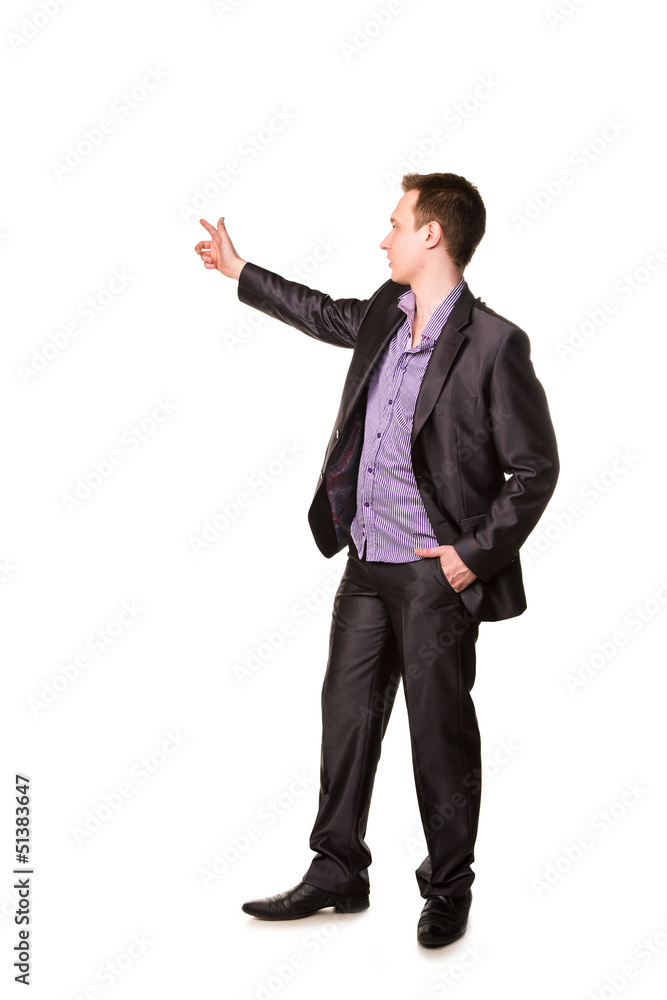 Happy young friendly smiling businessman pointing finger Happy young friendly smiling businessman pointing finger