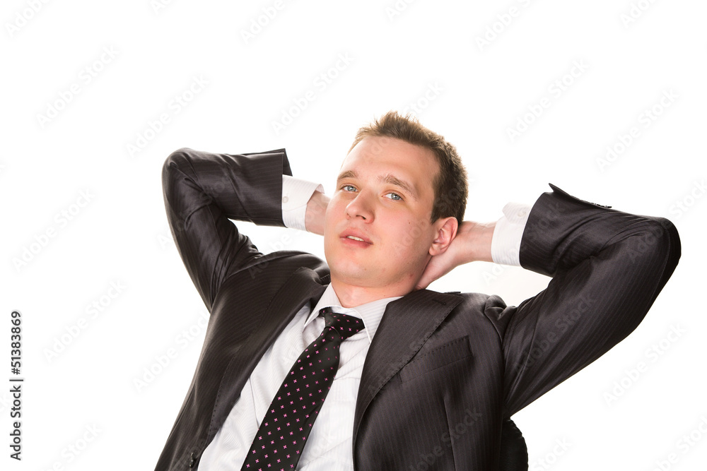 Confident smiling young businessman relaxing on a chair Confident smiling young businessman relaxing on a chair