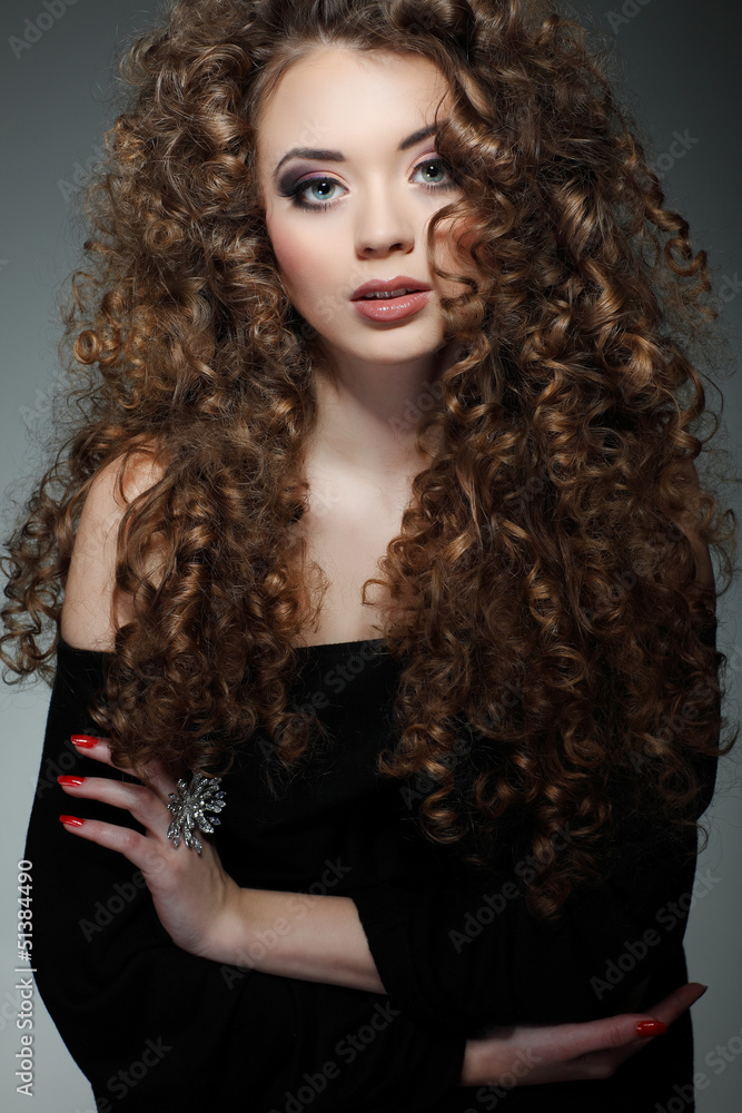 Young beautiful woman with long curly hairs Young beautiful woman with long curly hairs