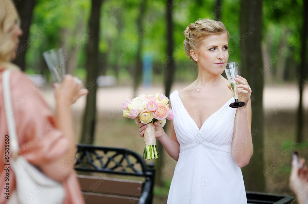 Bride holding champagne glass
