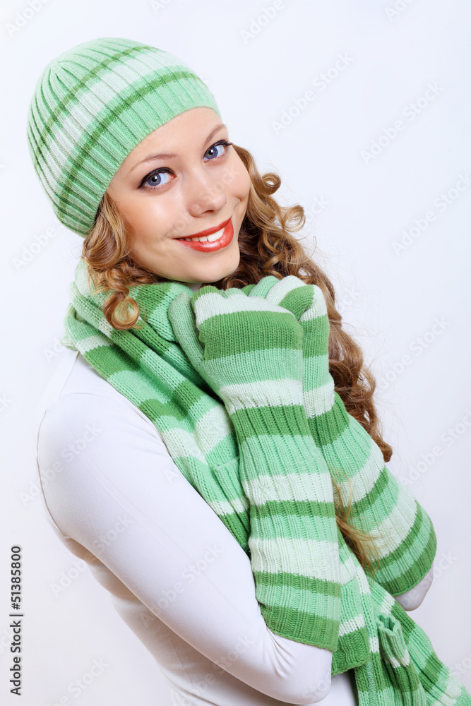 Young woman wearing winter hat and warm scarf Young woman wearing winter hat and warm scarf