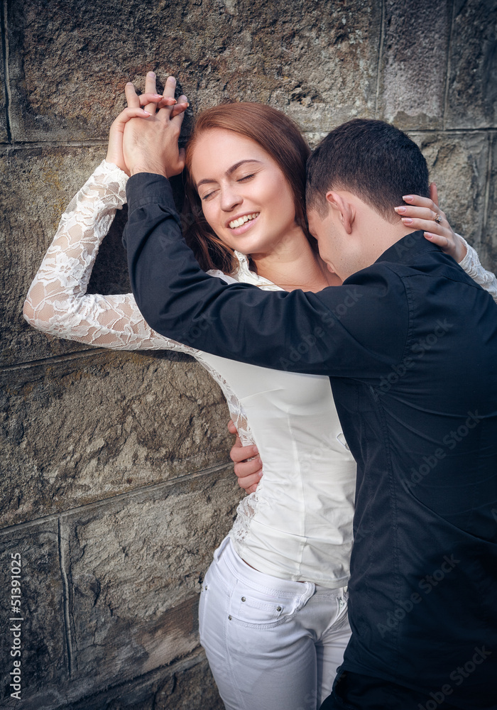 Love and affection between a young couple at the park Love and affection between a young couple at the park