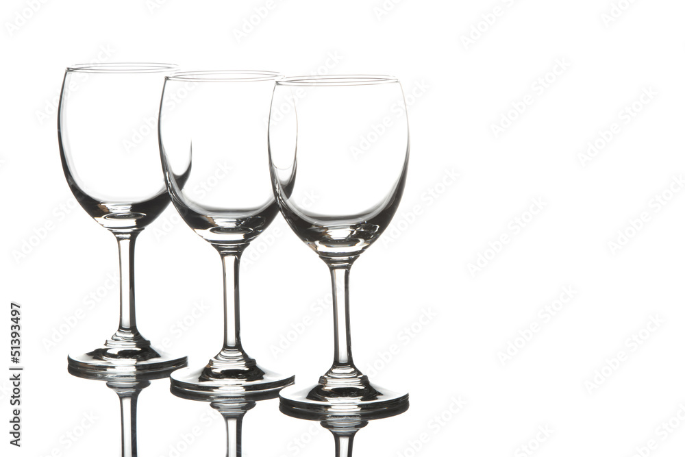 Three empty wine glasses on white background