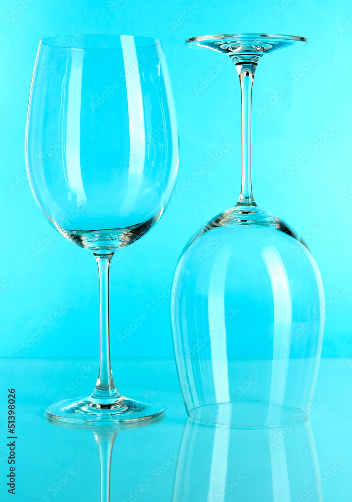 Two glasses on light blue background Two glasses on light blue background