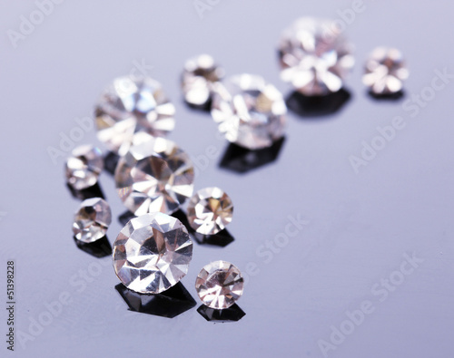 Fototapeta Naklejka Na Ścianę i Meble -  Beautiful shining crystals (diamonds), on grey background