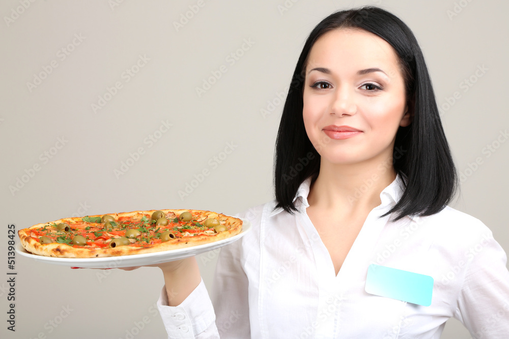 Beautiful girl waiter with pizza isolated on white