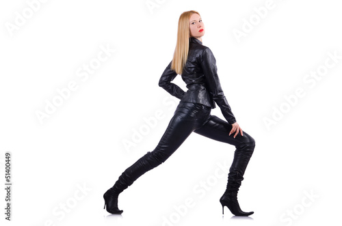 Tall model in leather costume on white
