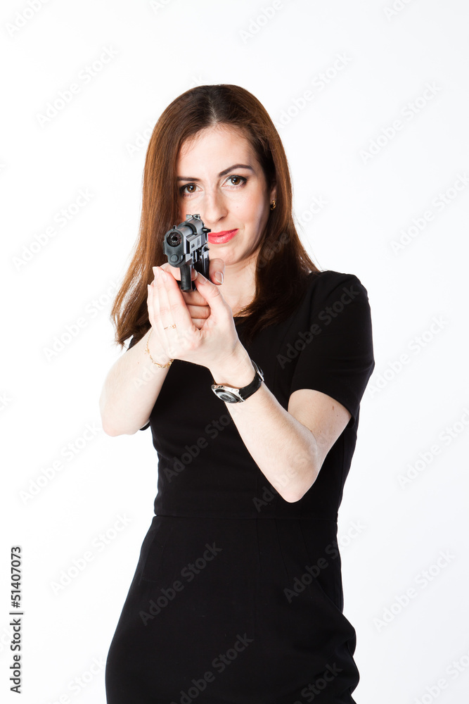 Young and beautiful woman with a gun