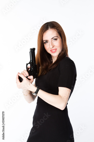 Young and beautiful woman with a gun