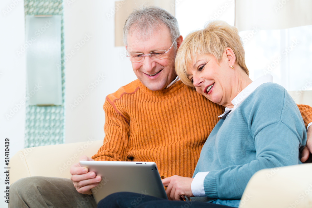 Seniors at home with tablet computer Seniors at home with tablet computer