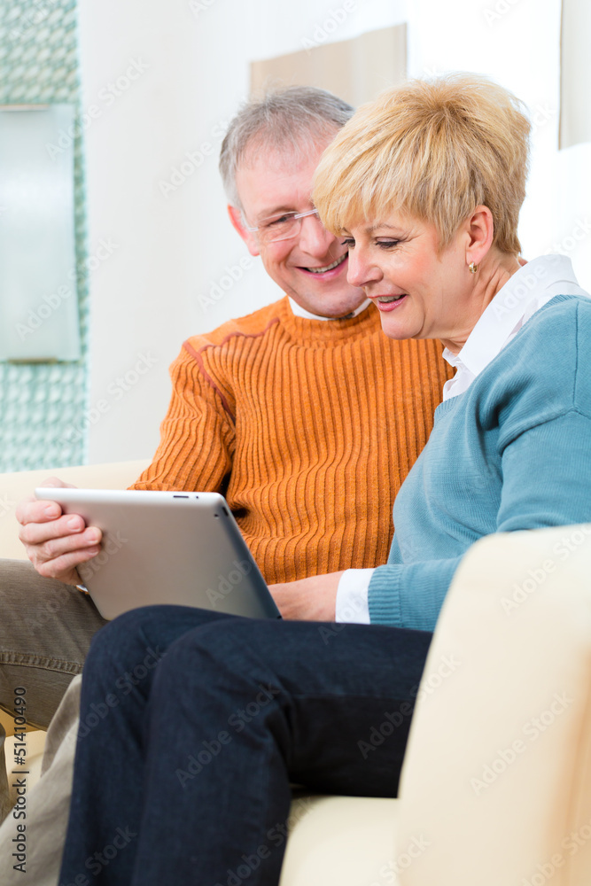 Seniors at home with tablet computer Seniors at home with tablet computer
