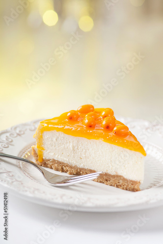 Tasty sea-buckthorn cake slice on beautiful plate