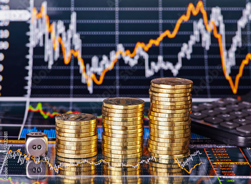 Uptrend stacks coins, dices cube with the word GO and calculator