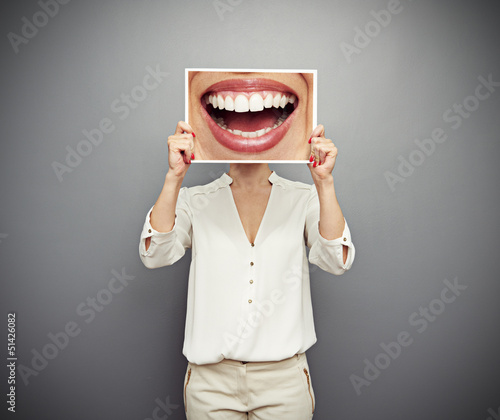 woman holding picture with big smile