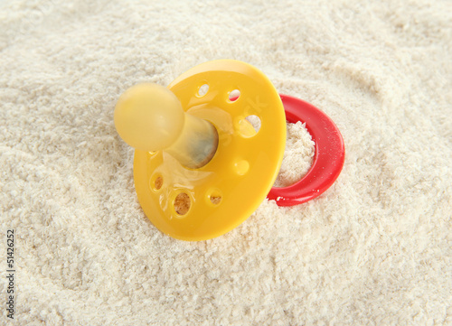 Powdered milk with nipple for baby  close-up