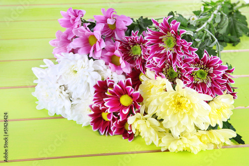 Bouquet of beautiful chrysanthemums on table close-up
