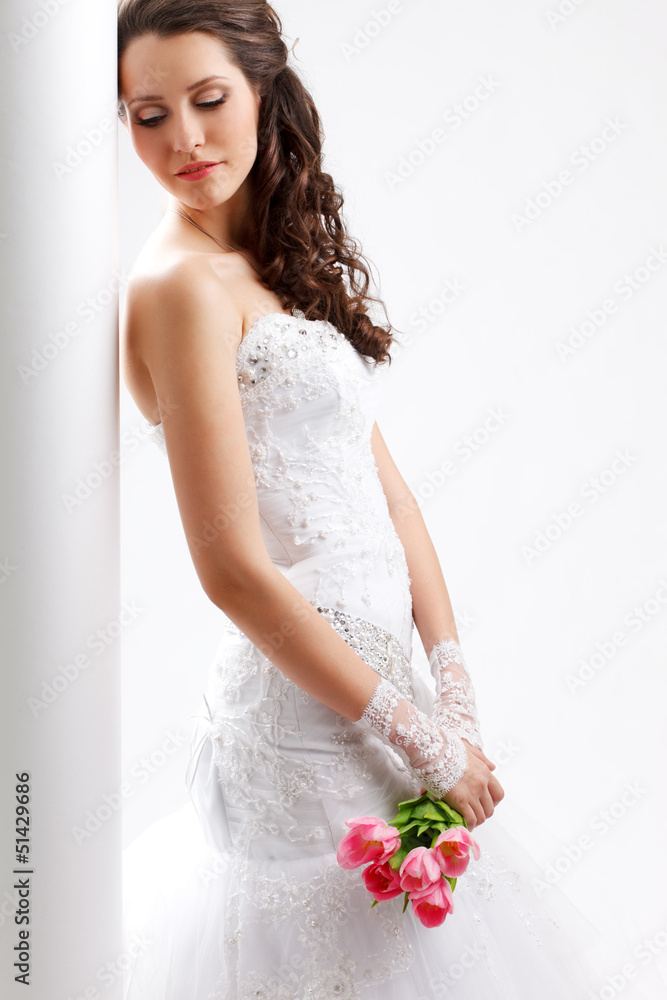beautiful bride standing near white column beautiful bride standing near white column
