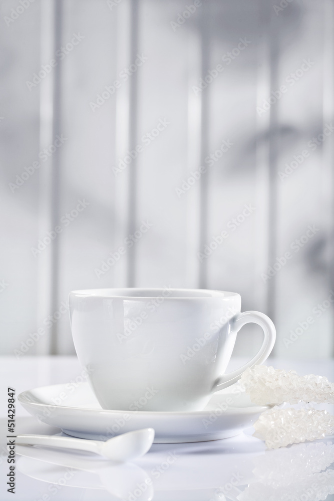 white ceramic coffee cup with spoon and sugar sticks white ceramic coffee cup with spoon and sugar sticks