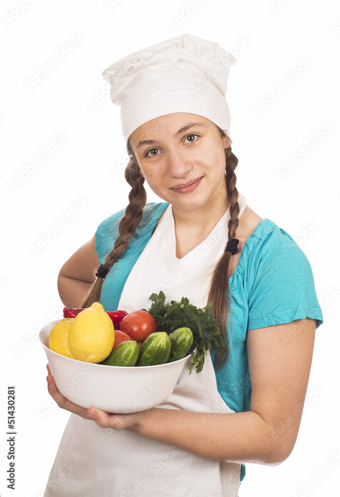 Girl teenager in a cap of cook with vegetables, lemon, Girl teenager in a cap of cook with vegetables, lemon,