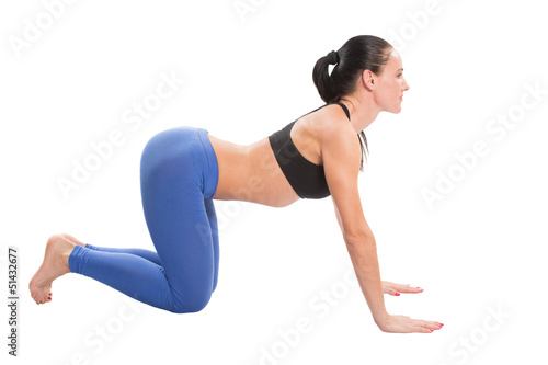 young yoga woman doing yogic exercise on isolated
