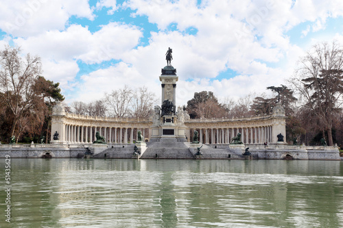 Monument to Alfonso XII and colonnade near pond in Retiro Park