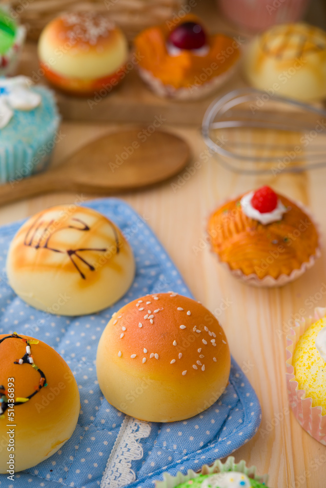 sweet vanilla bun cake bread with pastry decorations as backgrou