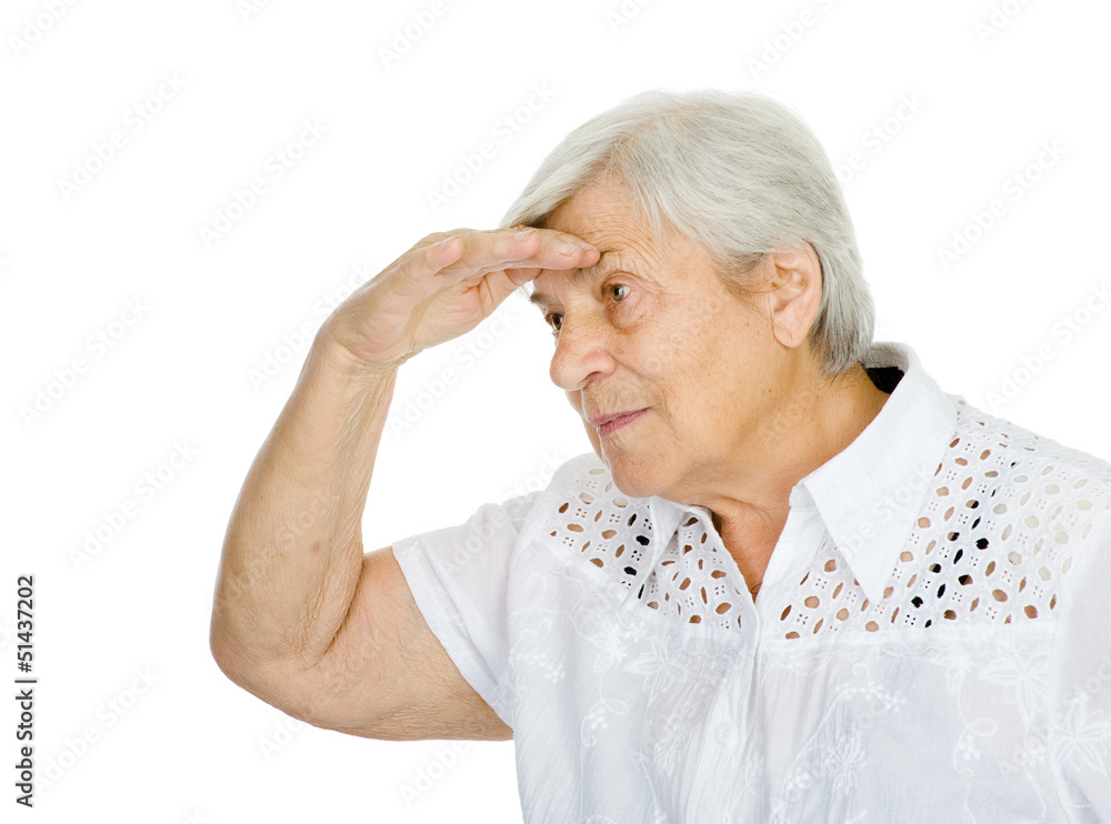 Old woman looking far, holding her arm hear her eyes. isolated