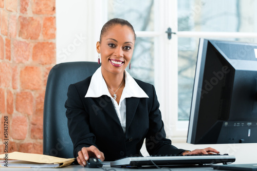 Картината върху платно Lawyer in office sitting on the computer