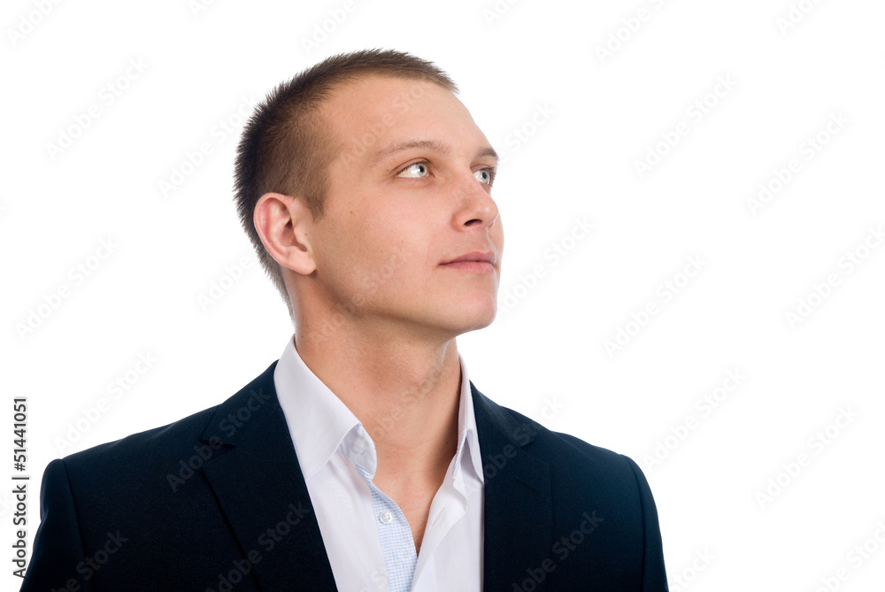 Close-up young businessman looking up, against Close-up young businessman looking up, against
