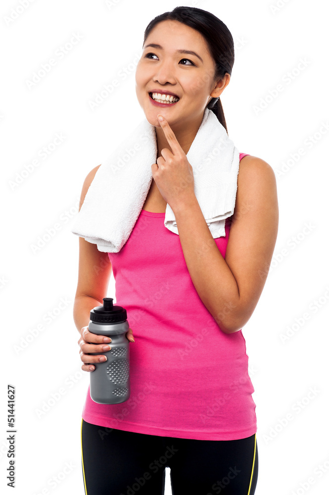 Smiling young asian female thinking and smiling Smiling young asian female thinking and smiling