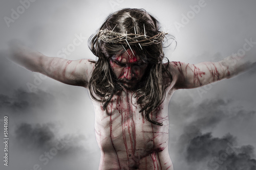 Fotografering representation of jesus christ on the cross on Cloud Background