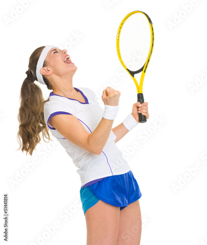 Happy female tennis player with racket rejoicing success © Alliance