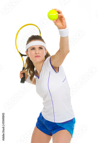 Confident female tennis player serving ball © Alliance