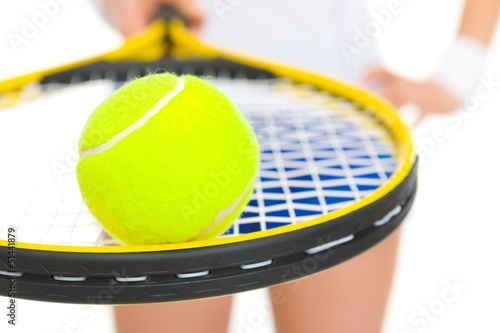 Closeup on female tennis player holding racket with ball © Alliance