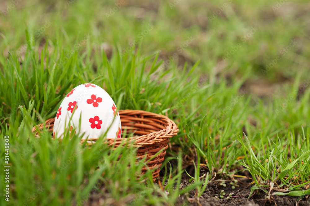 Easter Eggs in basket on grass Easter Eggs in basket on grass