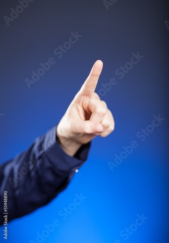 Woman's hand with finger, blue background