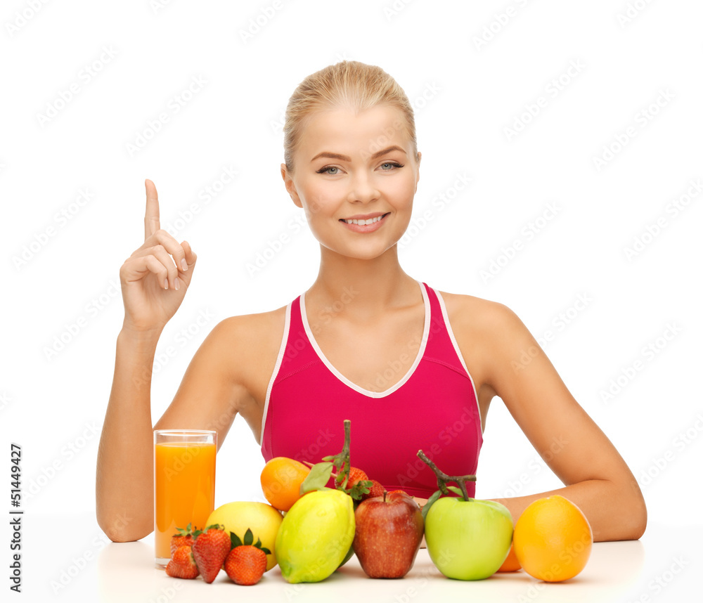 woman with juice and fruits holding finger up woman with juice and fruits holding finger up