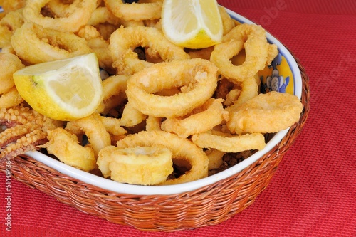 Fried calamari rings dipped in batter with lemon