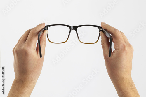 woman hand holding black glasses