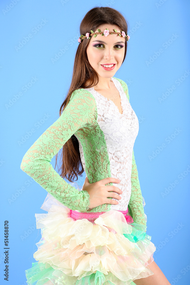 Beautiful spring woman portrait, on blue background Beautiful spring woman portrait, on blue background