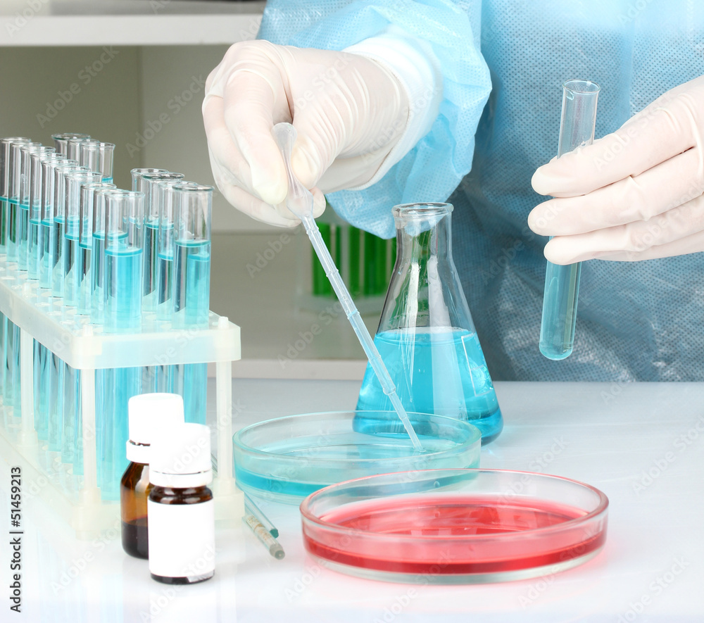 Scientist conducting research in laboratory close up Scientist conducting research in laboratory close up